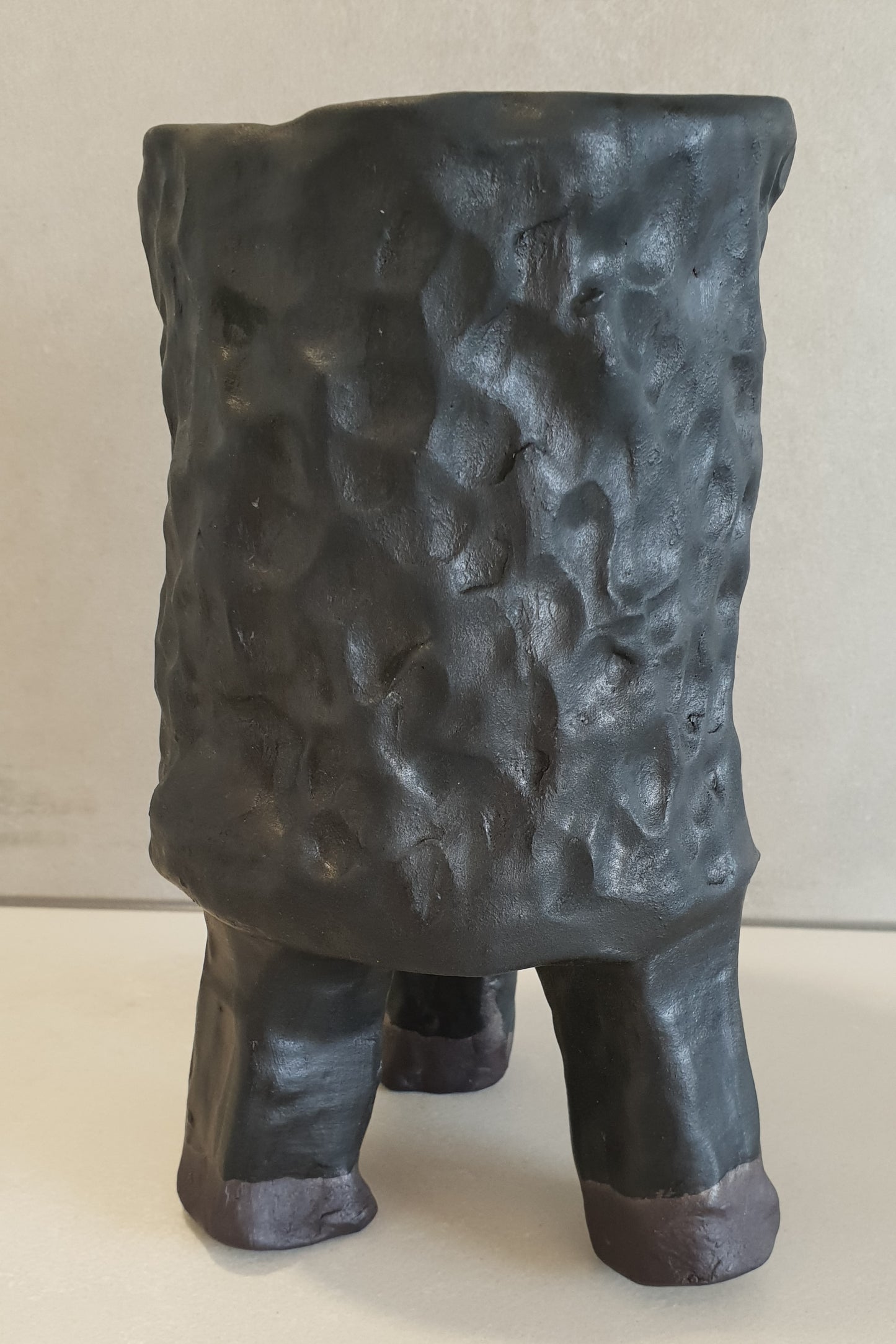Matt black vase with stand